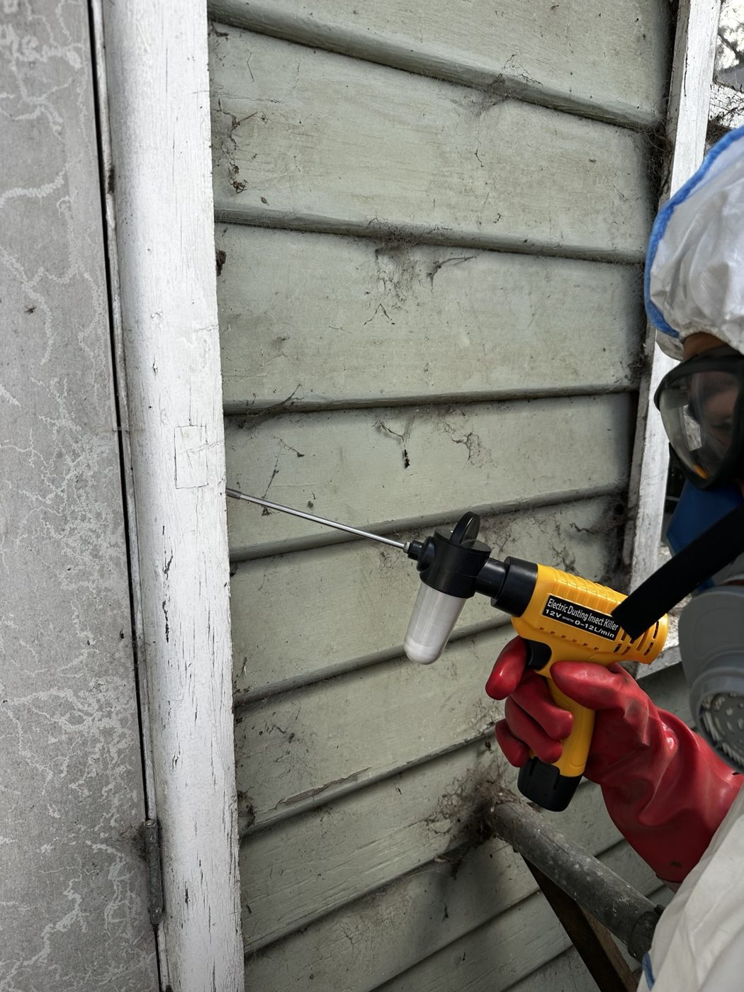 Technician working on a termite treatment